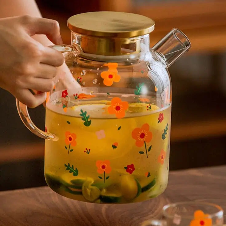 théière et tasse en verre avec fleur de thé en fleurs à l'intérieur 8585728  Photo de stock chez Vecteezy